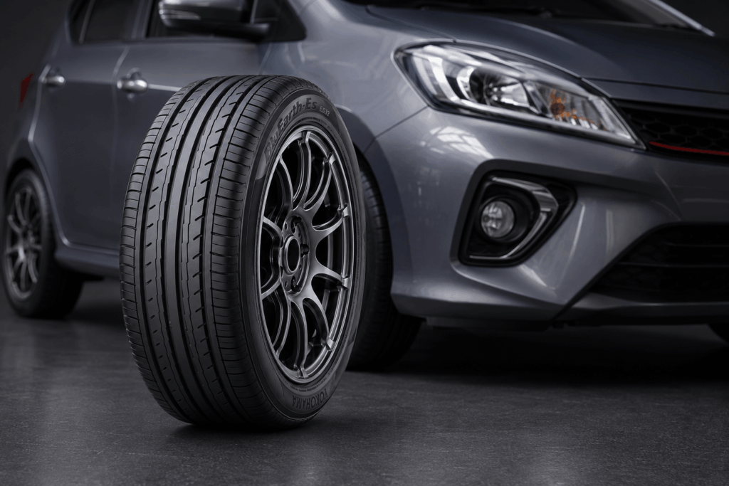 Yokohama BluEarth-Es ES32 tyre displayed in front of a modern Malaysian compact car.