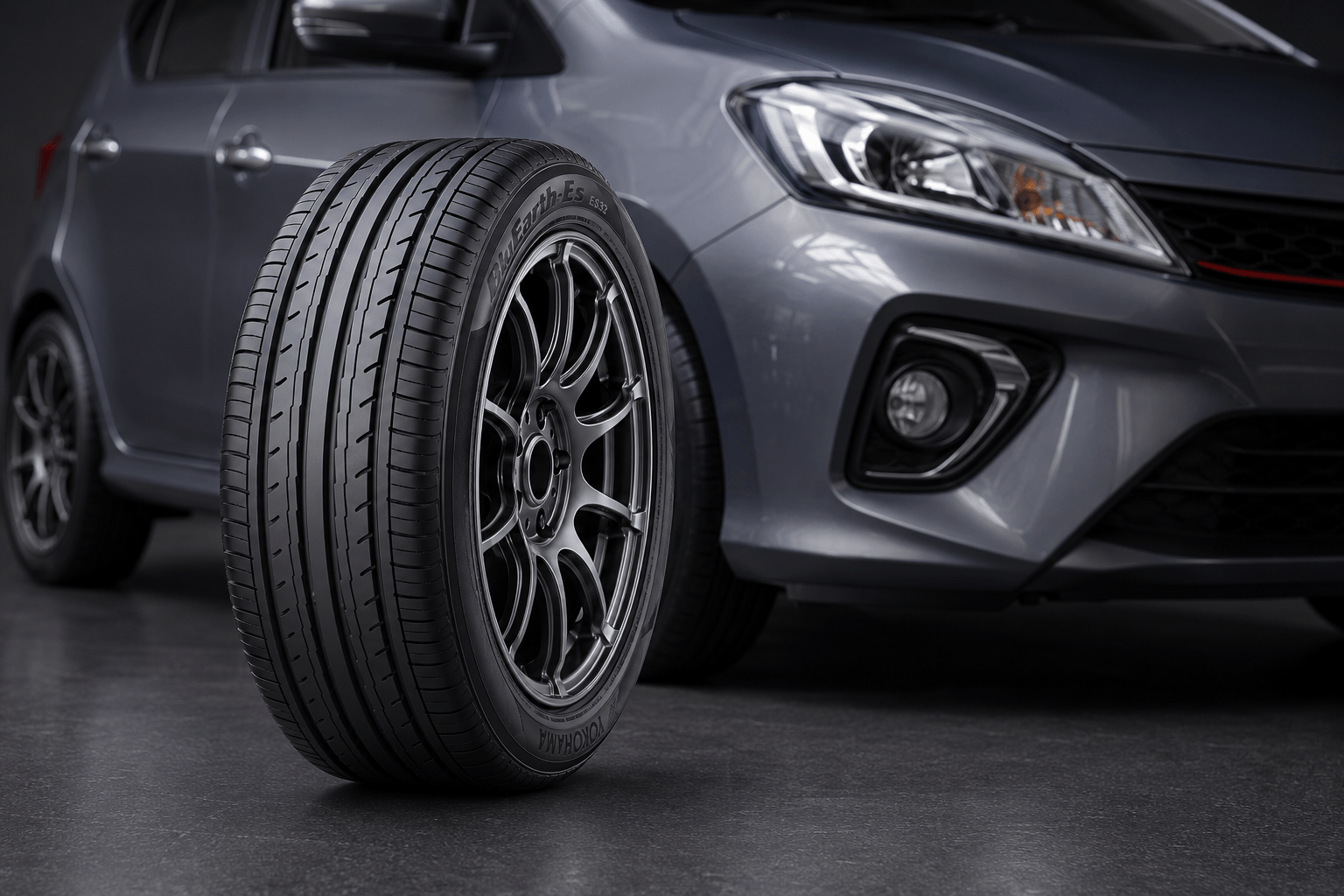 Yokohama BluEarth-Es ES32 tyre displayed in front of a modern Malaysian compact car.